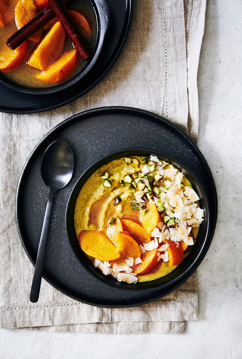 Turmeric porridge with quinoa flakes, coconut, persimmon fruit ...
